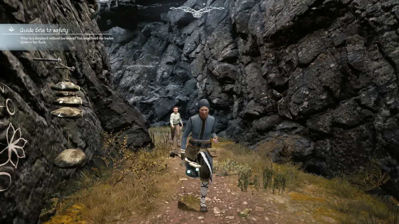 Brynhildur and a goat companion hiking a rocky canyon